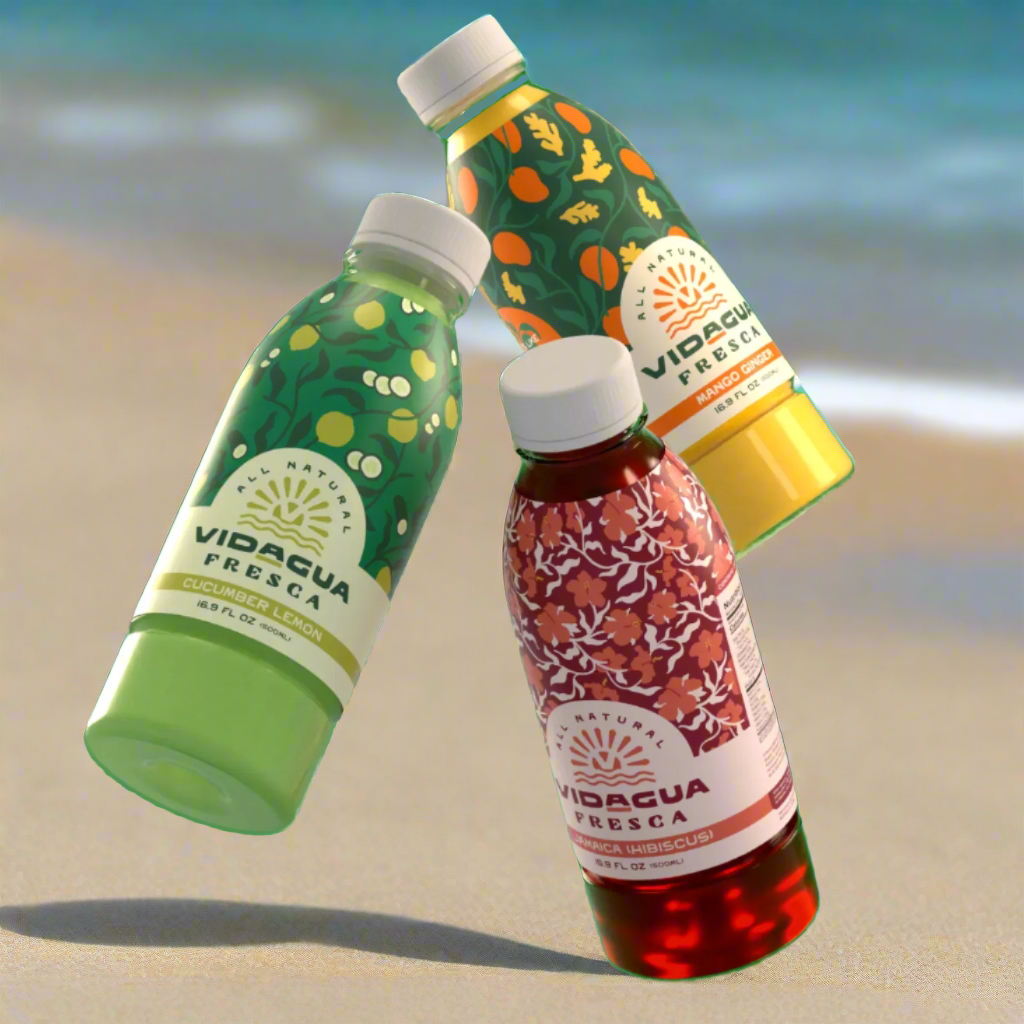 A Cucumber Lemon, Mango Ginger, and Jamaica (Hibiscus) Vidagua bottle next to each other